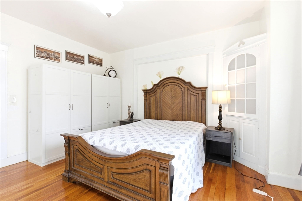 58 Bayfield Road Quincy, MA 02171 - Photo 17 of 27 a bedroom with a bed and a window