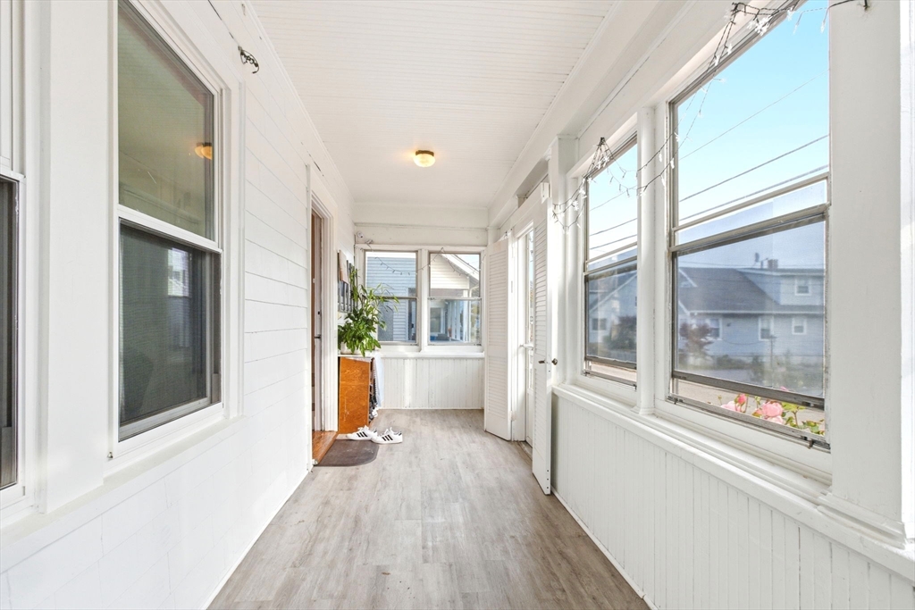 58 Bayfield Road Quincy, MA 02171 - Photo 21 of 27 a view of a big room with wooden floor and windows