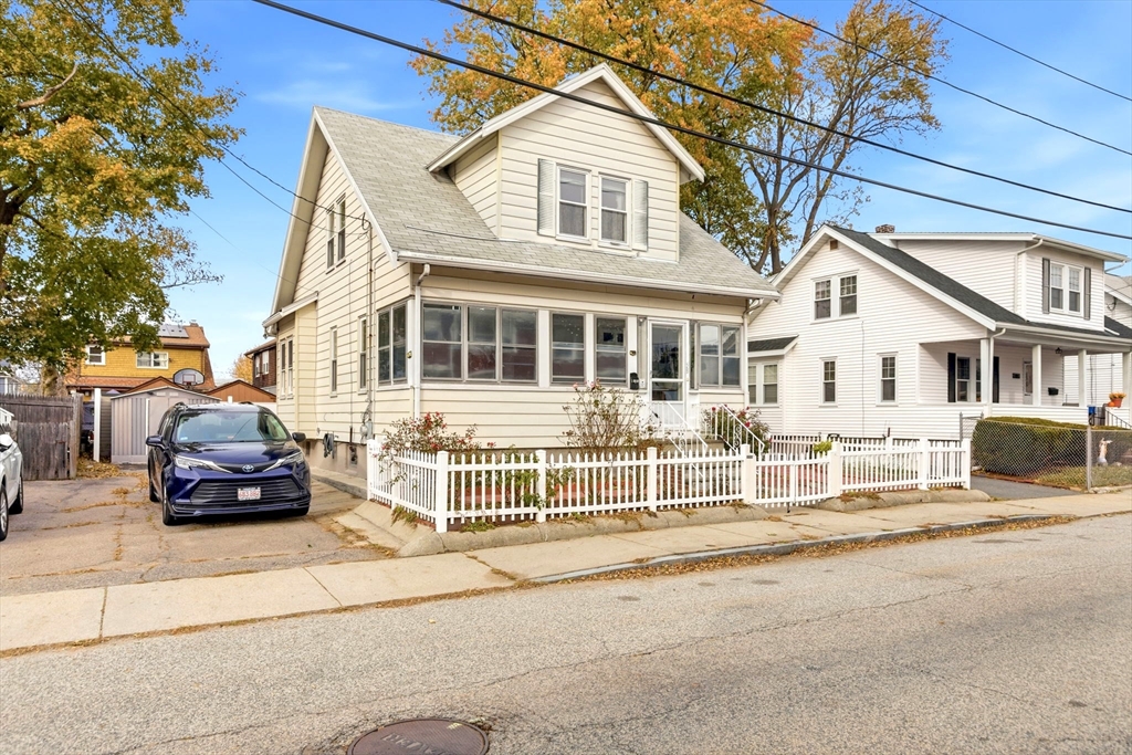 58 Bayfield Road Quincy, MA 02171 - Photo 23 of 27 a car parked in front of a white house