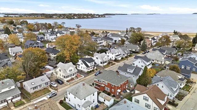 an aerial view of a house with a lake view