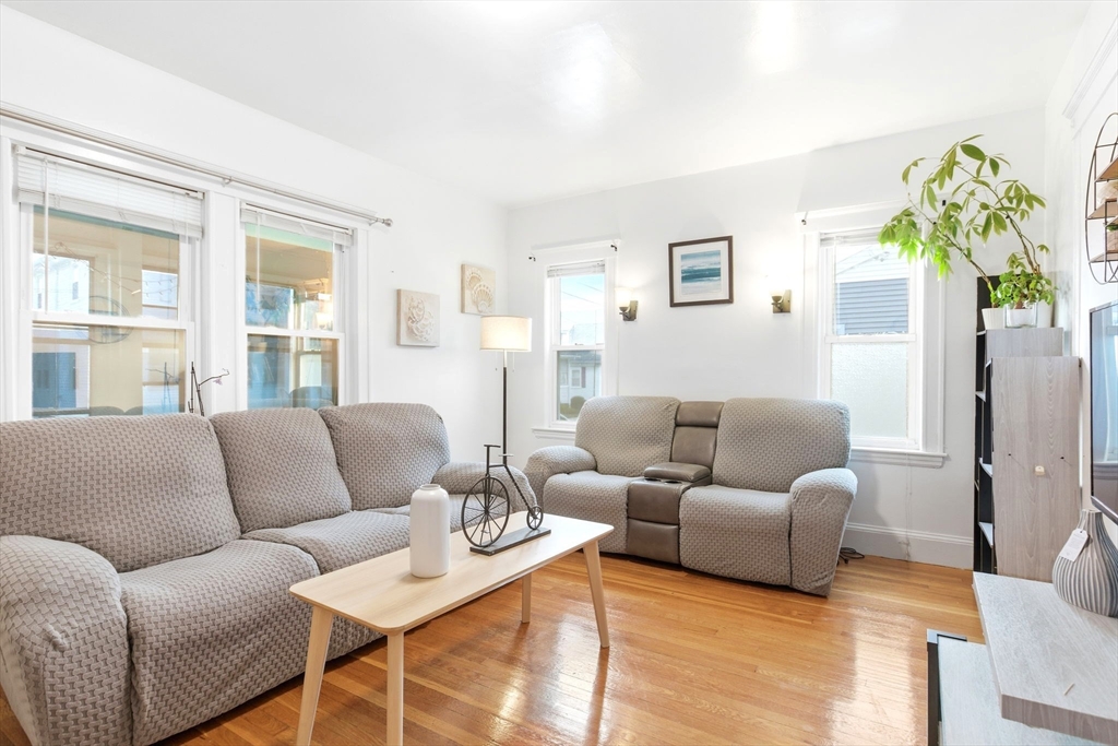 58 Bayfield Road Quincy, MA 02171 - Photo 3 of 27 a living room with furniture and a potted plant