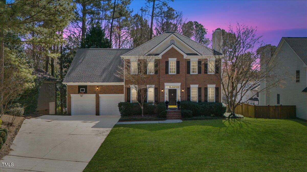4617 Wee Burn Trail Raleigh, NC 27612 - Photo 1 of 70 a front view of a house with garden