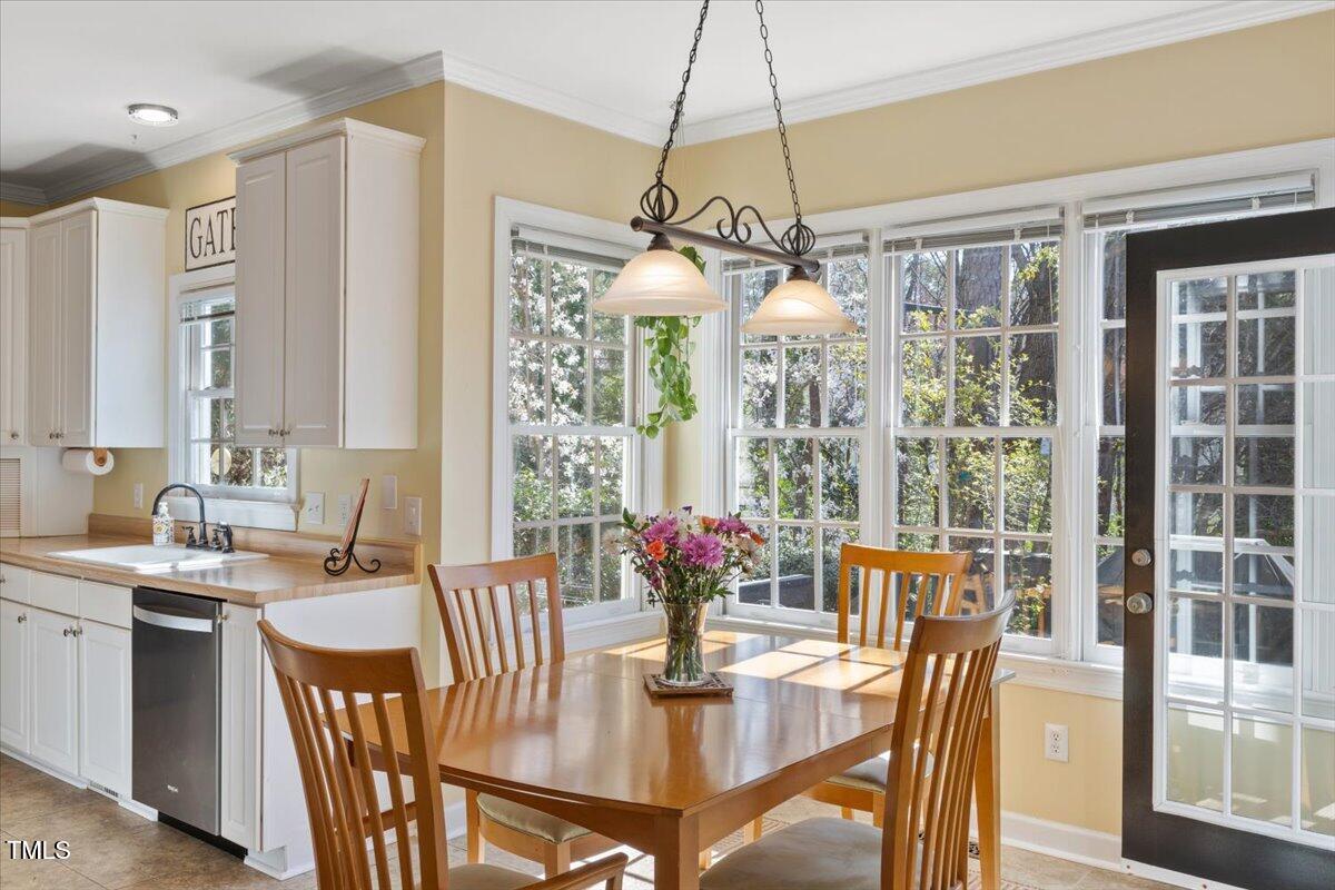 4617 Wee Burn Trail Raleigh, NC 27612 - Photo 17 of 70 a view of a dining room with furniture window and outside view