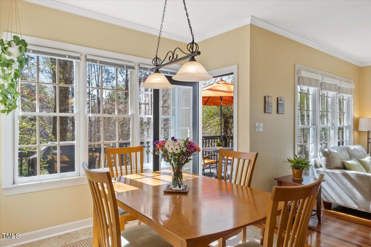 4617 Wee Burn Trail Raleigh, NC 27612 - Photo 18 of 70 a view of a dining room with furniture window and wooden floor