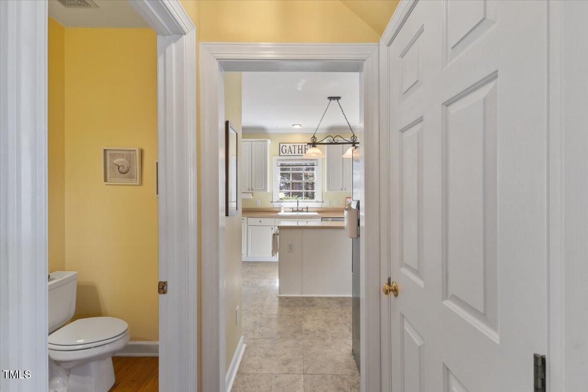 4617 Wee Burn Trail Raleigh, NC 27612 - Photo 27 of 70 a bathroom with a granite countertop sink mirror and toilet
