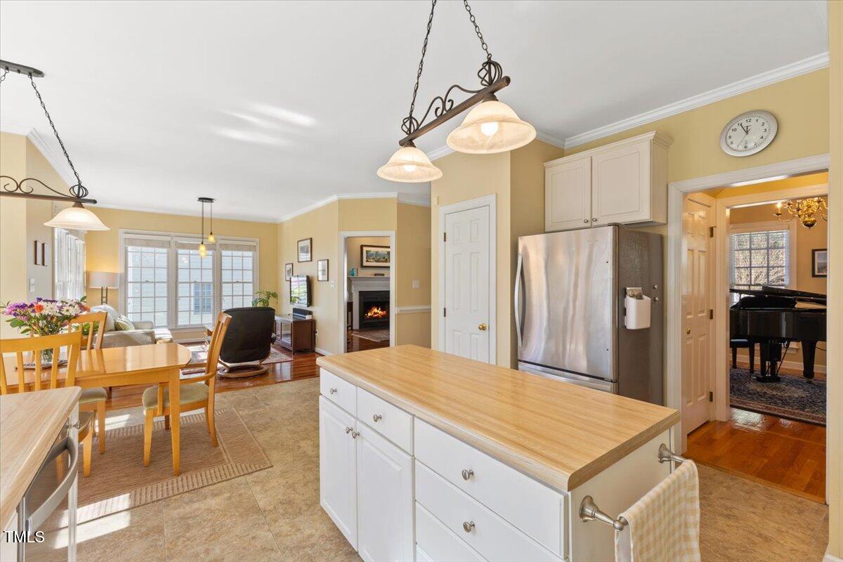 4617 Wee Burn Trail Raleigh, NC 27612 - Photo 30 of 70 a kitchen with stainless steel appliances granite countertop a stove and a refrigerator