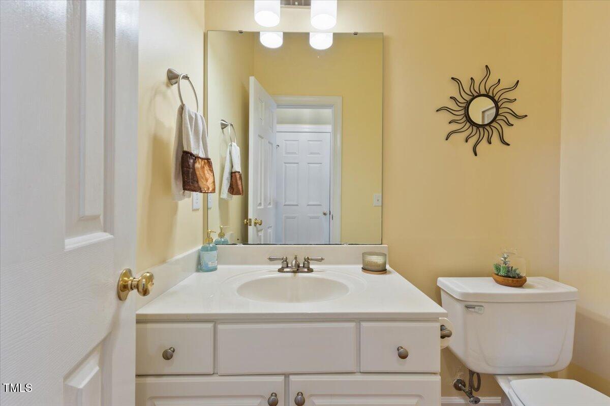 4617 Wee Burn Trail Raleigh, NC 27612 - Photo 32 of 70 a bathroom with a sink and a mirror