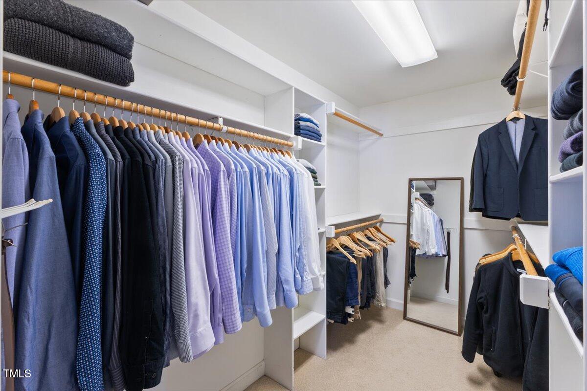 4617 Wee Burn Trail Raleigh, NC 27612 - Photo 43 of 70 a view of walk in closet with clothes and shoes