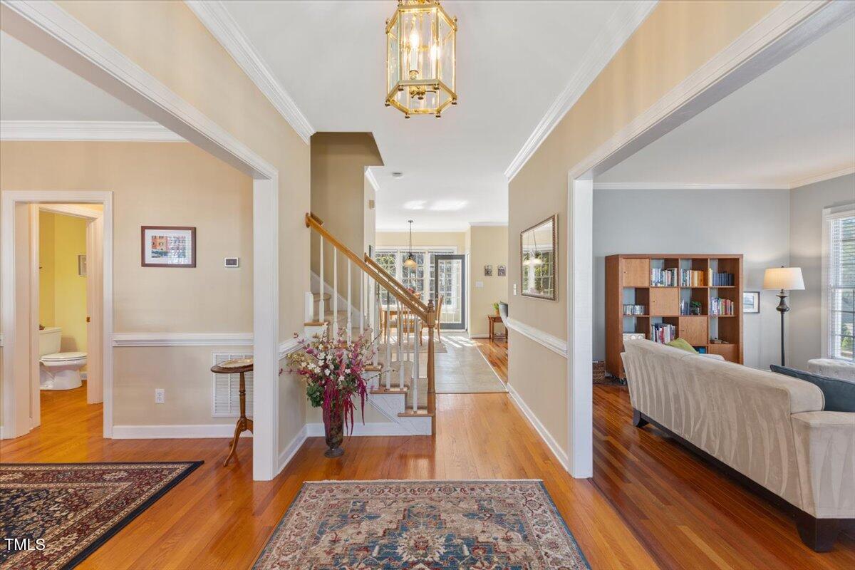 4617 Wee Burn Trail Raleigh, NC 27612 - Photo 3 of 70 a living room with furniture and wooden floor