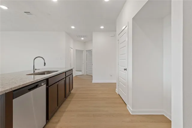 a kitchen with a sink and cabinets
