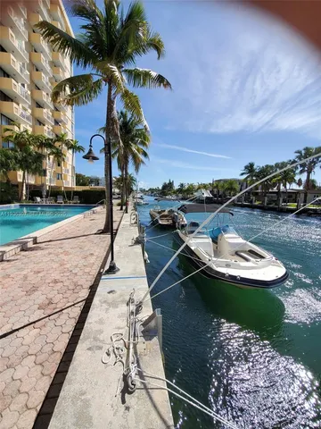 a view of a tall building with a yard