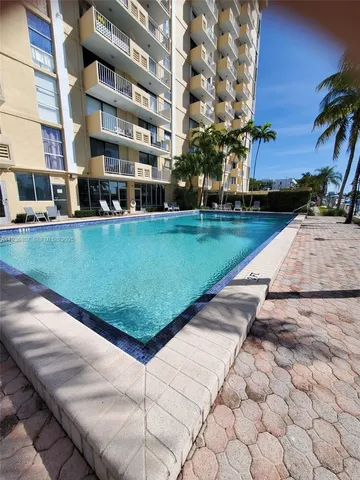 a view of a swimming pool with a patio