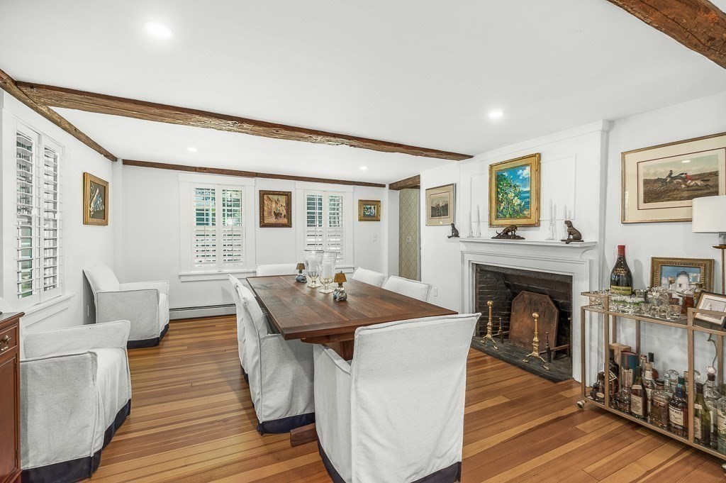 968 Bay Road Hamilton, MA 01982 - Photo 24 of 42 a living room with fireplace furniture and a wooden floor