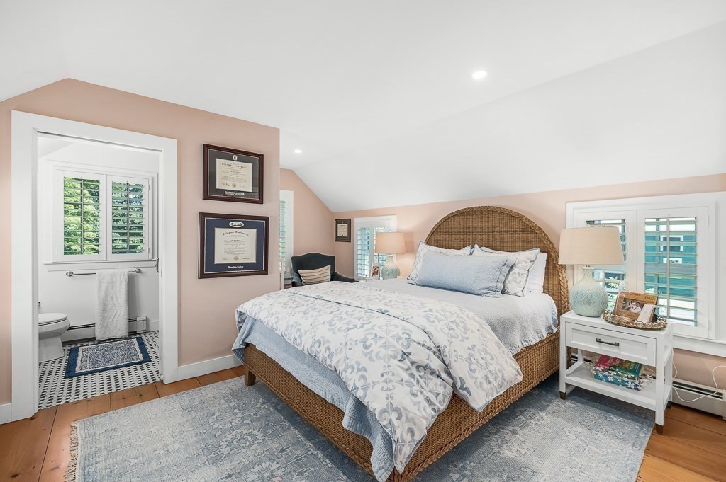 968 Bay Road Hamilton, MA 01982 - Photo 31 of 42 a bedroom with a bed a mirror and a window