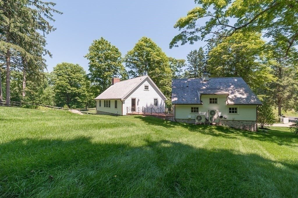968 Bay Road Hamilton, MA 01982 - Photo 39 of 42 a front view of a house with a yard and trees