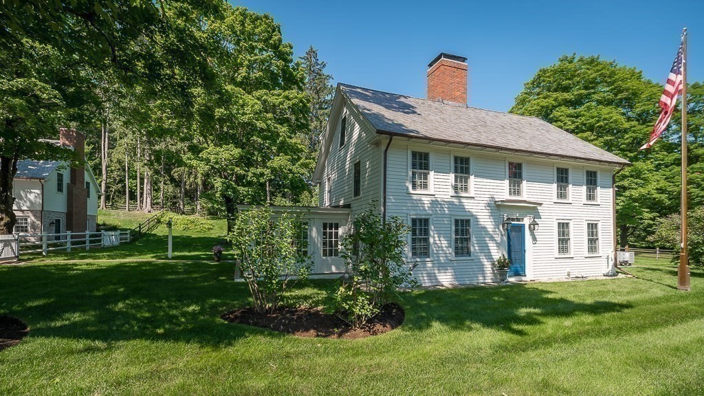 968 Bay Road Hamilton, MA 01982 - Photo 6 of 42 a front view of a house with a yard