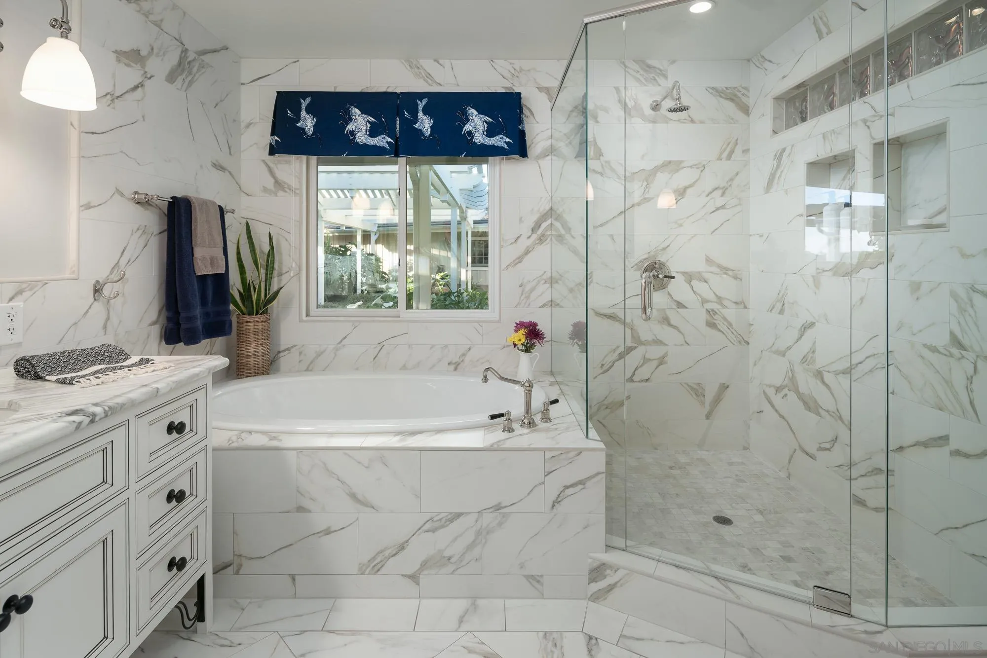 5632 La Crescenta Road Rancho Santa Fe, CA 92067 - Photo 17 of 24 a bathroom with a bathtub a sink and a shower