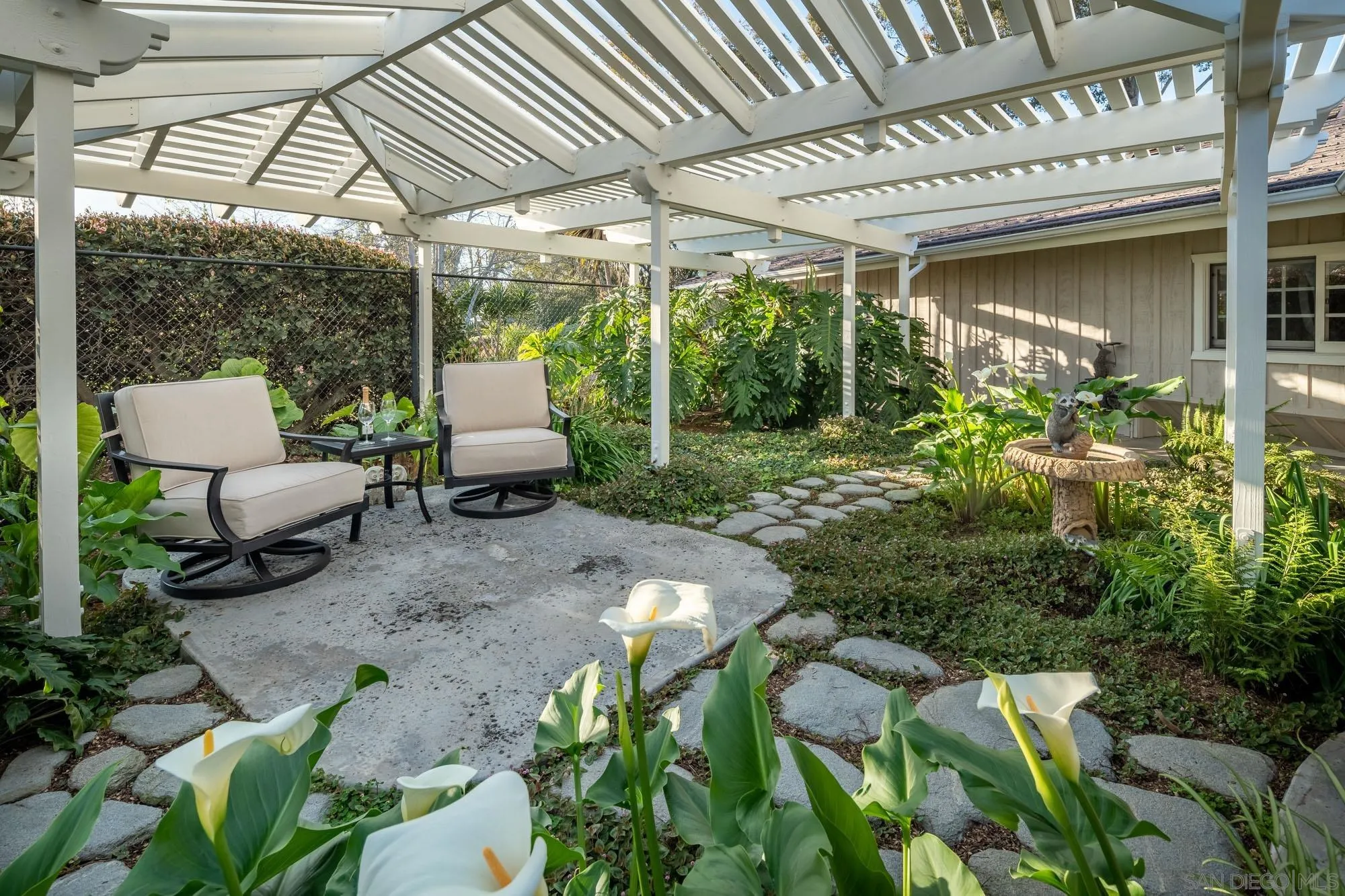 5632 La Crescenta Road Rancho Santa Fe, CA 92067 - Photo 18 of 24 a view of a patio with table and chairs and potted plants