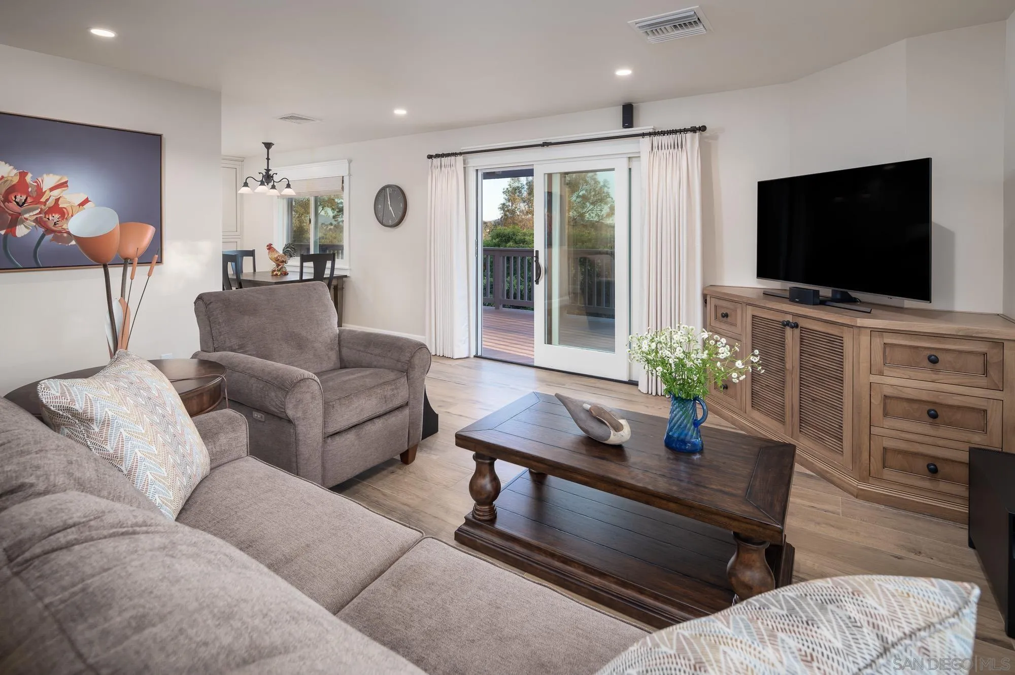 5632 La Crescenta Road Rancho Santa Fe, CA 92067 - Photo 21 of 24 a living room with furniture and a flat screen tv