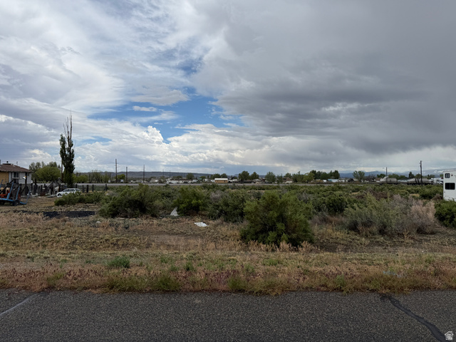 Undisclosed Address Emery, UT 84522 - Photo 3 of 4 Expansive undeveloped lot featuring natural shrubbery and a clear sky overhead