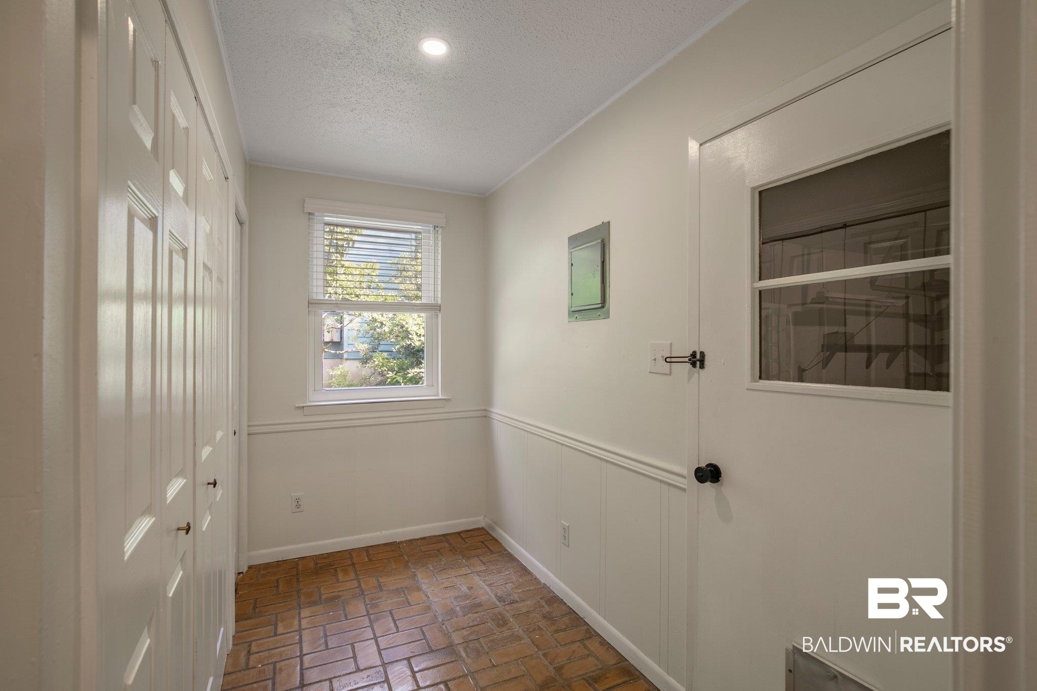 115 Ronforth Street Fairhope, AL 36532 - Photo 9 of 29 Kitchen pantry and utility leading to garage