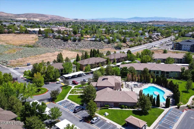 a view of house with garden and tall trees