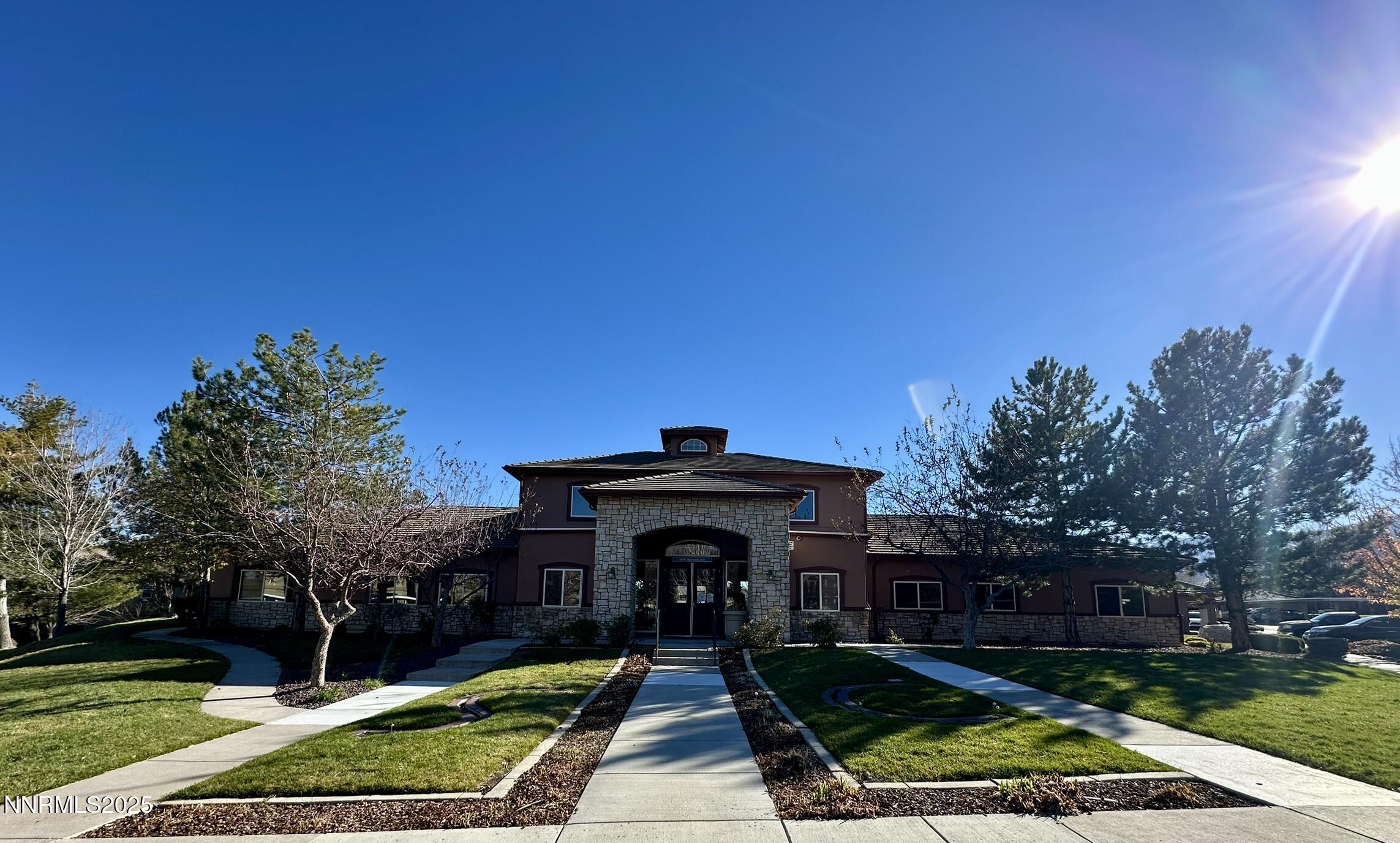6850 Sharlands Avenue Reno, NV 89523 - Photo 22 of 25 a view of house with garden and tall trees