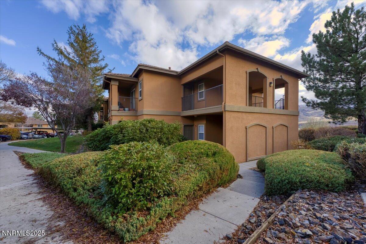 6850 Sharlands Avenue Reno, NV 89523 - Photo 3 of 25 a front view of a house with garden
