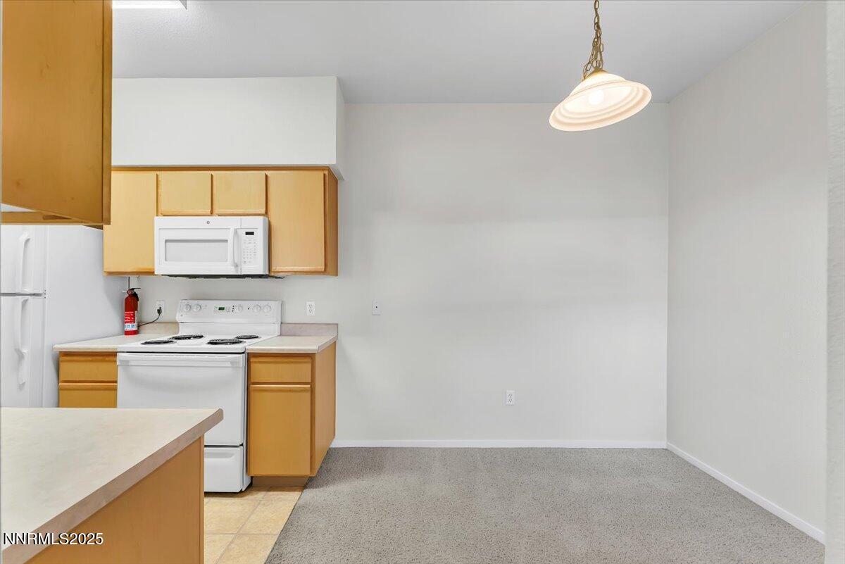 6850 Sharlands Avenue Reno, NV 89523 - Photo 8 of 25 a room with a sink a stove and mirror
