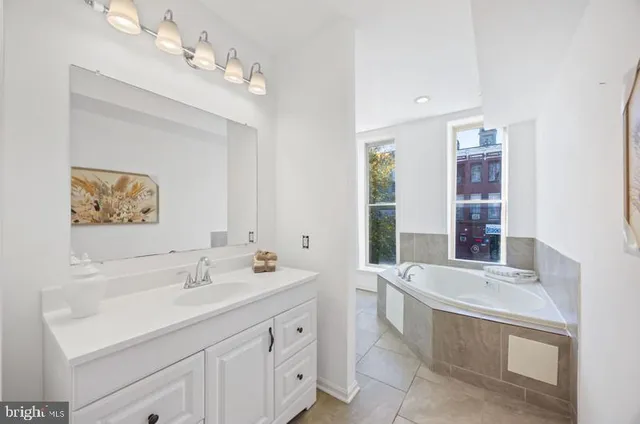 a bathroom with a bathtub and a toilet