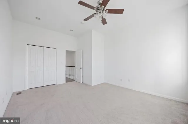a bathroom with a toilet a sink a vanity and mirror