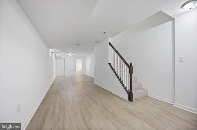 a brick building with a bench in front of it