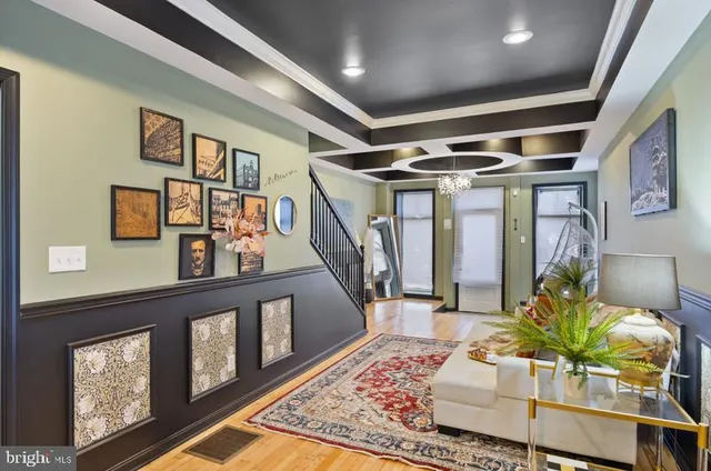 a living room with furniture and flowers