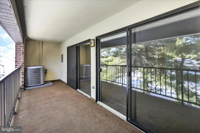 a kitchen with a sink a refrigerator and cabinets