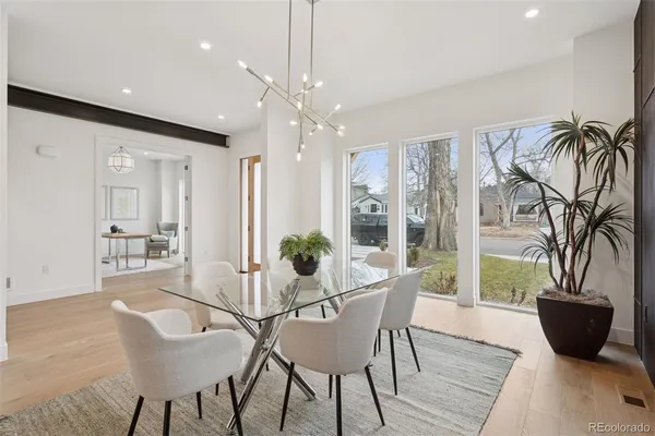 a view of a dining room with furniture window and wooden floor