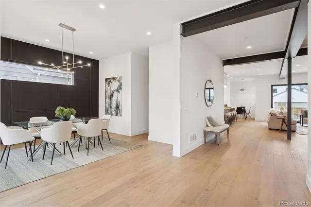 a living room with furniture a rug and a chandelier