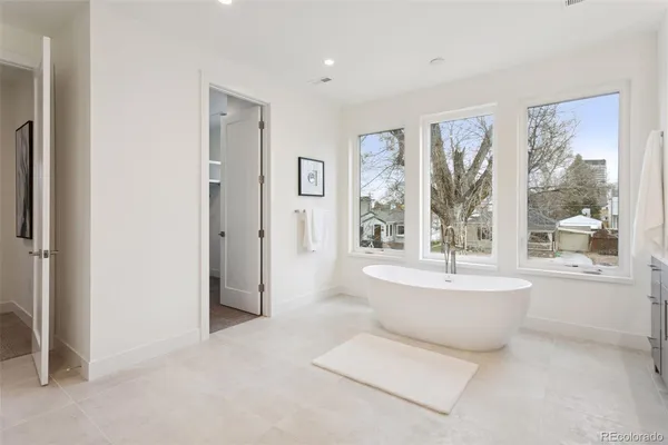 a bathroom with a bathtub sink and toilet