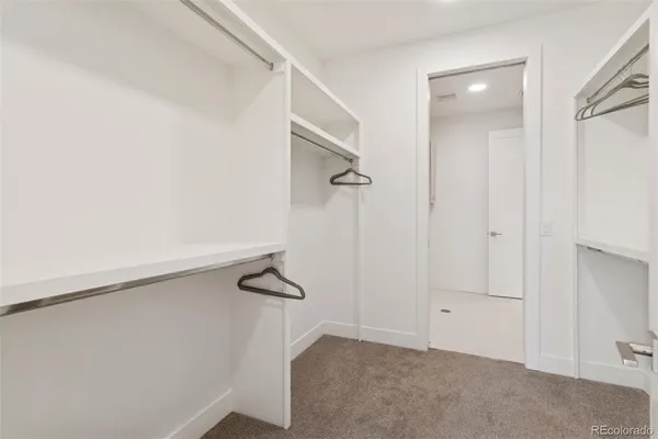 a kitchen with cabinets and white appliances