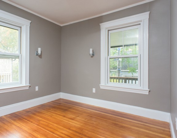 3 Wilson Avenue, Unit 2 Cambridge, MA 02140 - Photo 13 of 17 a view of an empty room with wooden floor and a window