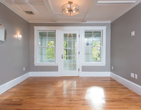 3 Wilson Avenue, Unit 2 Cambridge, MA 02140 - Photo 4 of 17 a view of empty room with wooden floor and fan
