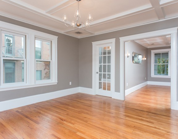 3 Wilson Avenue, Unit 2 Cambridge, MA 02140 - Photo 9 of 17 a view of an empty room with wooden floor and a window