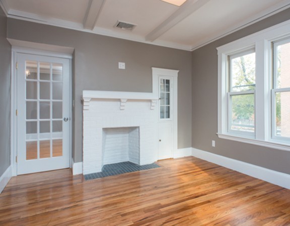 3 Wilson Avenue, Unit 2 Cambridge, MA 02140 - Photo 10 of 17 an empty room with wooden floor cabinet and windows
