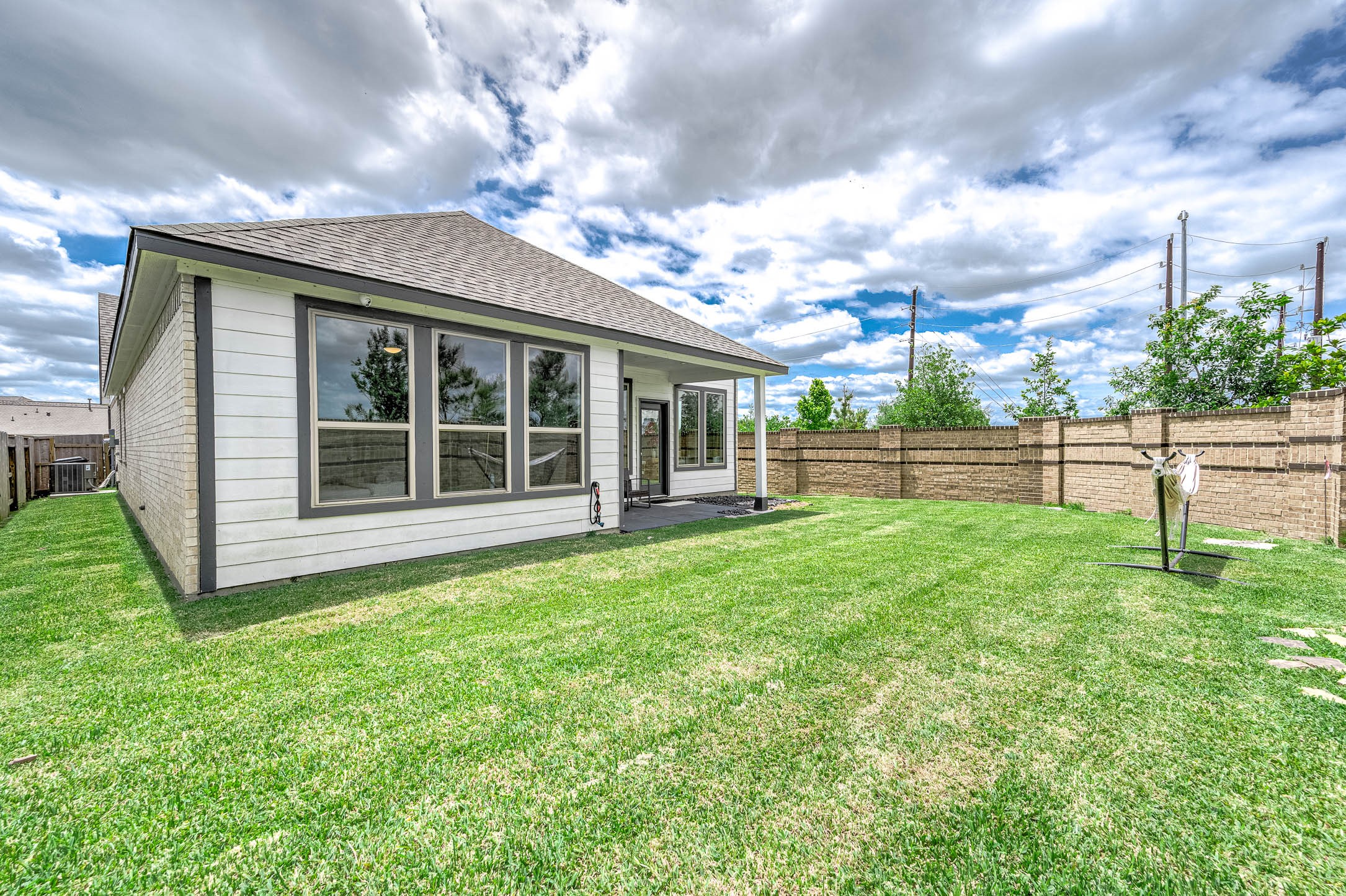 10926 Wander Way Beasley, TX 77417 - Photo 25 of 38 a view of a house with a backyard