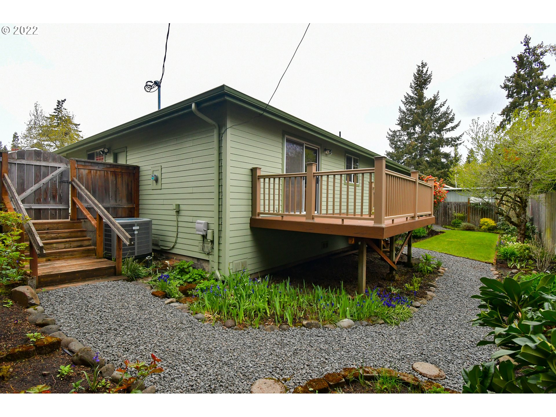 3925 Pearl Street Eugene, OR 97405 - Photo 16 of 21 a backyard of a house with wooden deck and outdoor seating