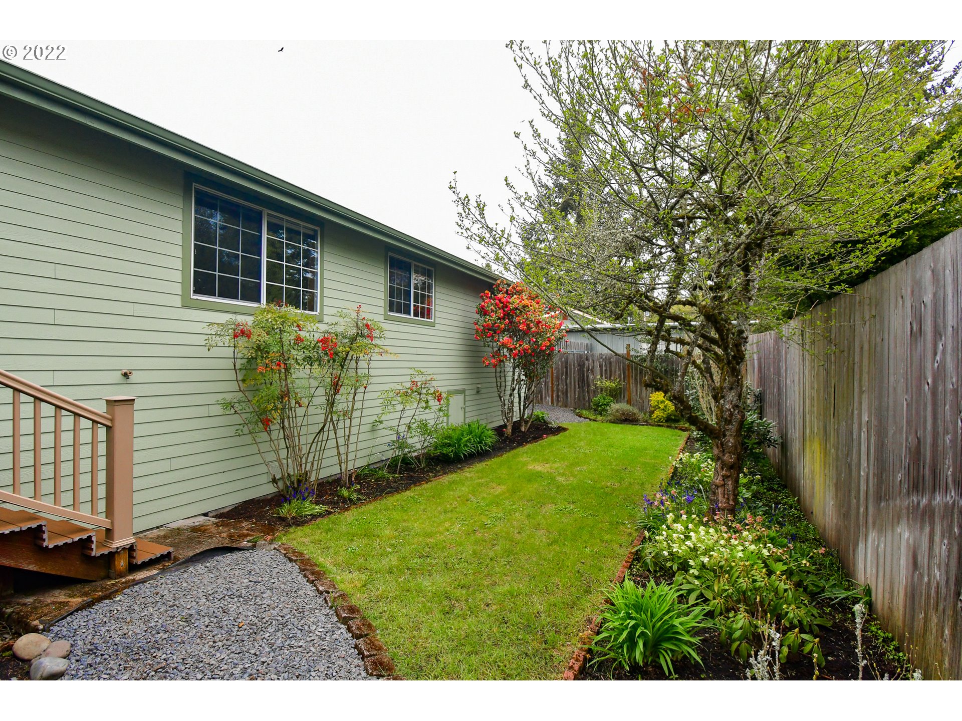 3925 Pearl Street Eugene, OR 97405 - Photo 17 of 21 a view of backyard with potted plants and wooden fence