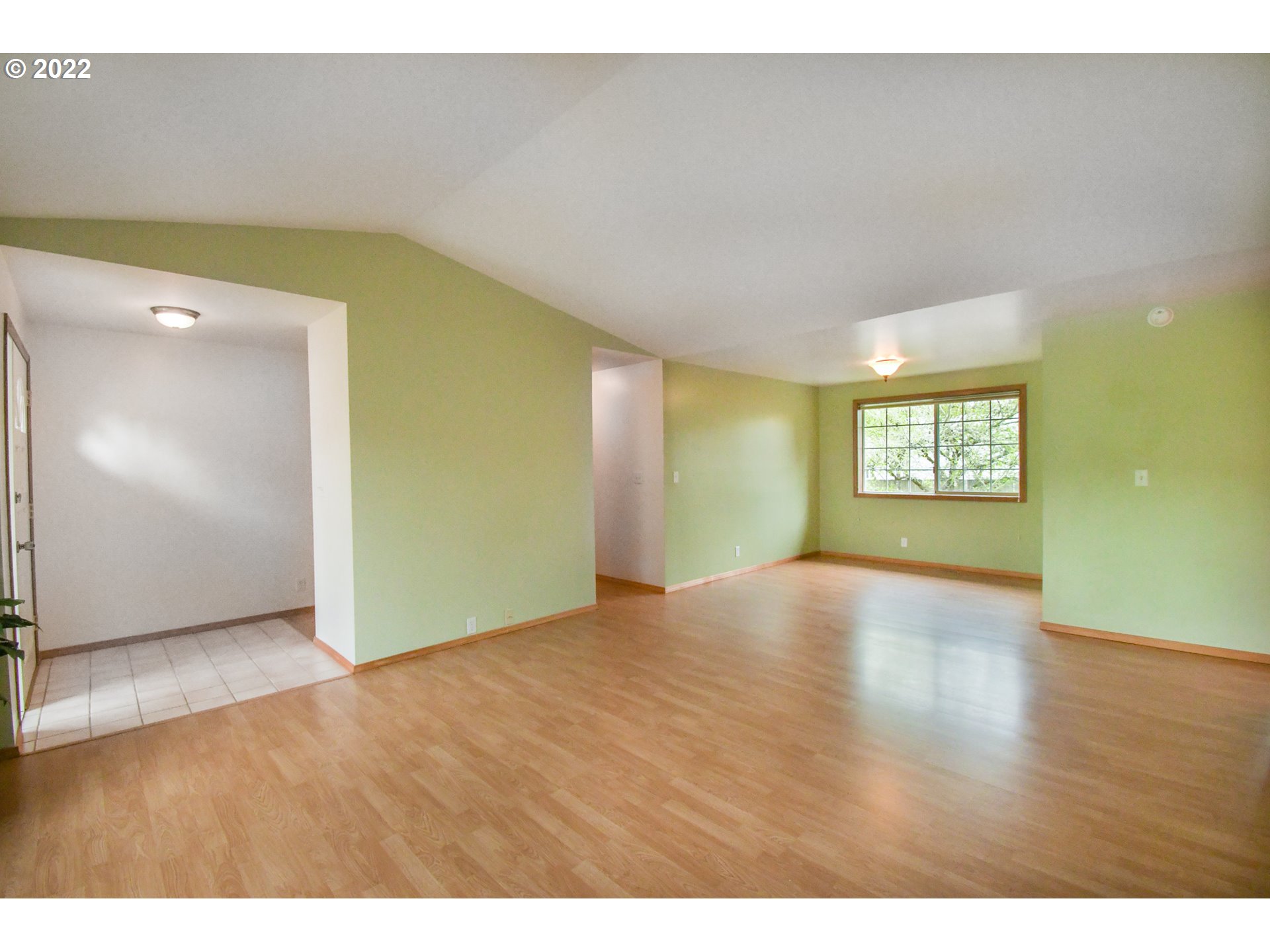 3925 Pearl Street Eugene, OR 97405 - Photo 4 of 21 a view of an empty room with window and wooden floor
