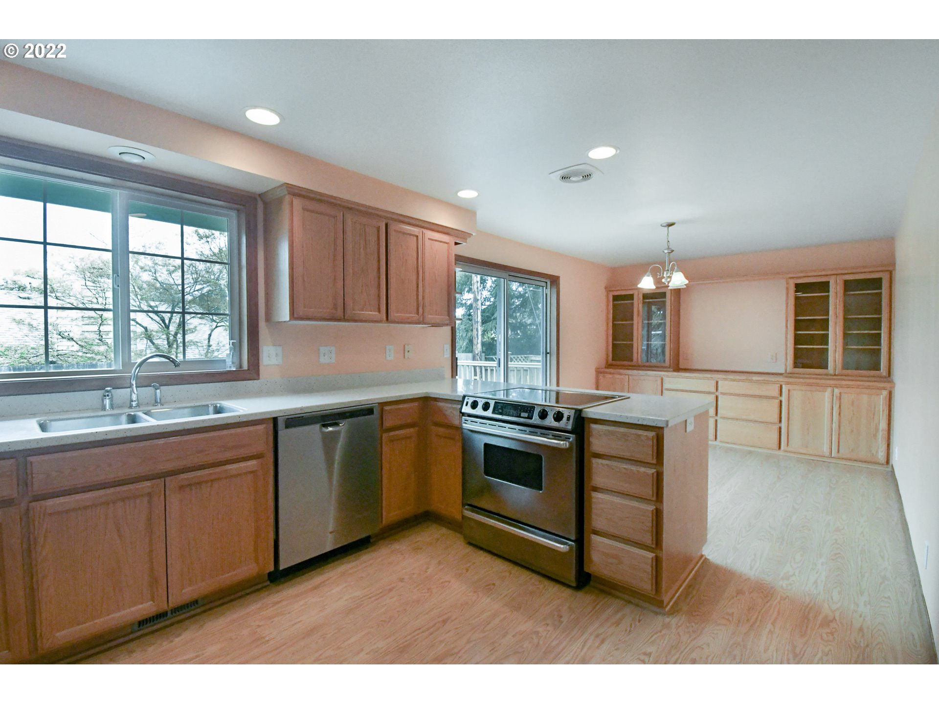 3925 Pearl Street Eugene, OR 97405 - Photo 6 of 21 a kitchen with stainless steel appliances granite countertop a stove a sink and a microwave