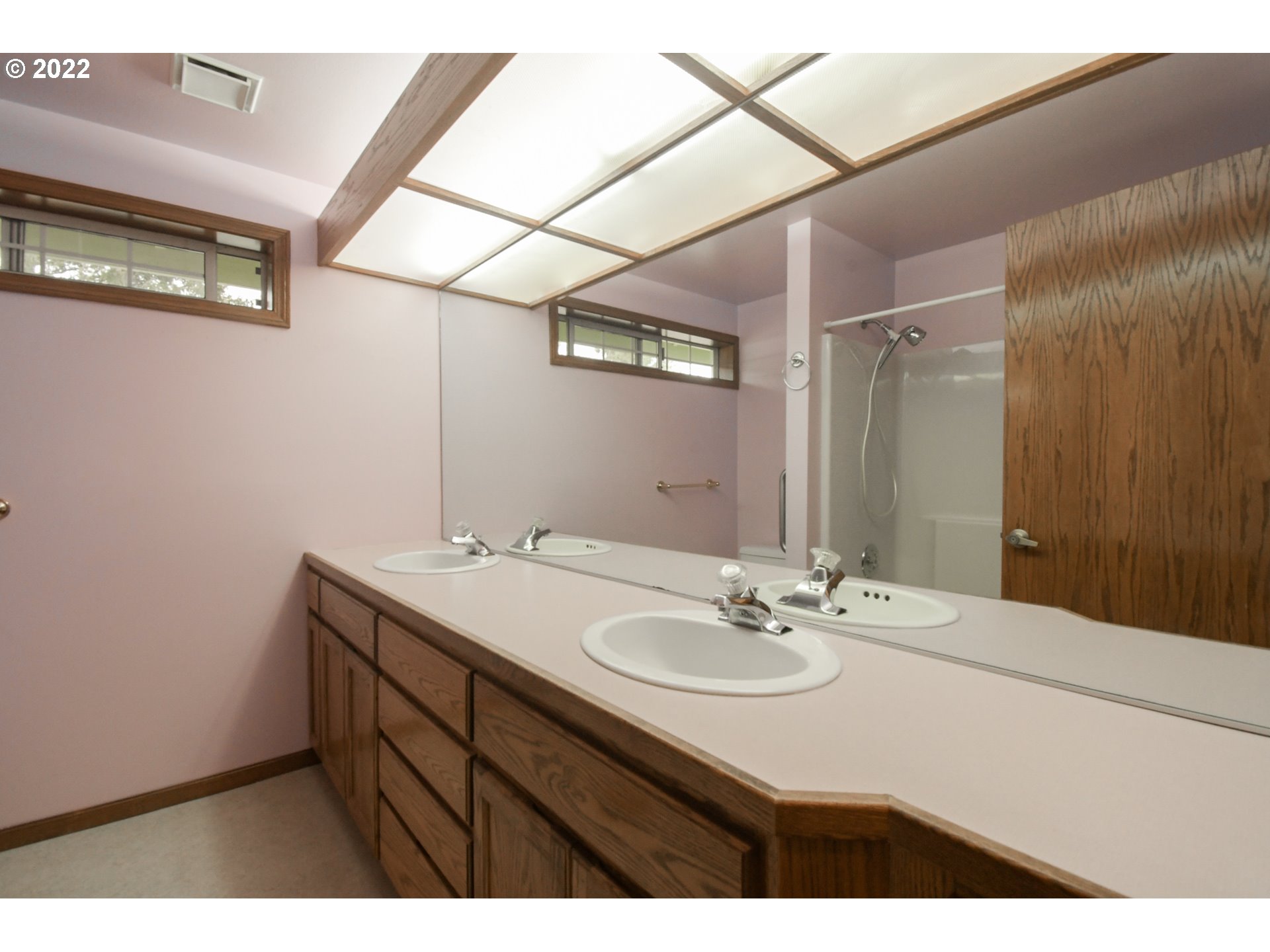 3925 Pearl Street Eugene, OR 97405 - Photo 9 of 21 a bathroom with a sink vanity and a mirror