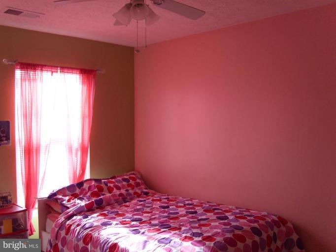 613 MacDill Road Middle River, MD 21220 - Photo 14 of 19 a bedroom with a bed and a window