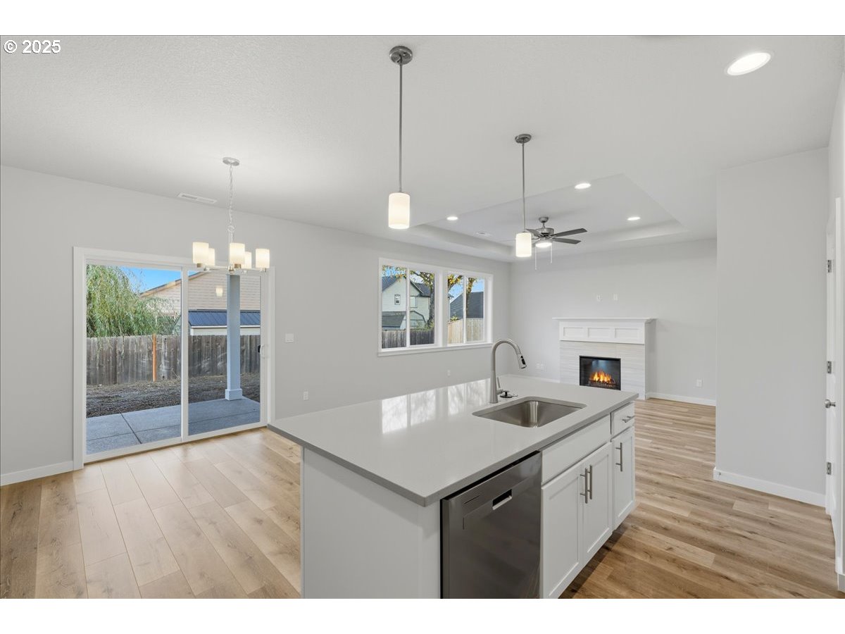 405 South Cedar Street Yamhill, OR 97148 - Photo 13 of 36 a kitchen with kitchen island a sink and a stove